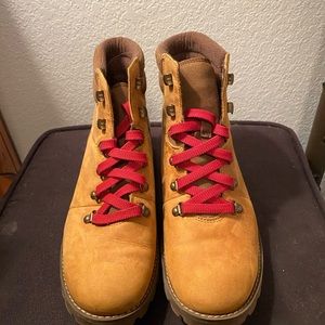 Brown Timberland boots with red laces